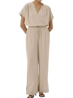 Pantalon chino beige uni pourvu d'une coupe bootcut et d'une taille haute
