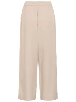 Pantalon chino beige uni pourvu d'une coupe bootcut et d'une taille haute