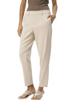 Pantalon chino beige uni pourvu d'une coupe slim et d'une taille intermédiaire