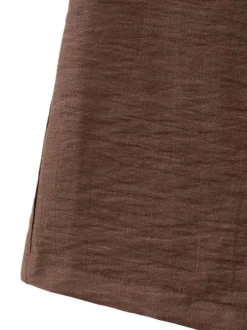 Pantalon chino chocolat uni pourvu d'une coupe large et d'une taille haute