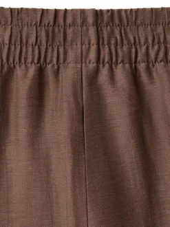 Pantalon chino chocolat uni pourvu d'une coupe large et d'une taille haute