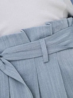 Pantalon chino ciel uni pourvu d'une coupe bootcut et d'une taille haute