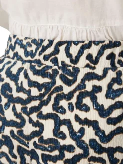 Pantalon chino écru à motifs pourvu d'une coupe bootcut et d'une taille haute