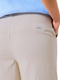 Pantalon chino écru uni en velours côtelé avec une coupe bootcut
