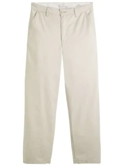 Pantalon chino en coton beige coupe ample pourvu du patch de la marque