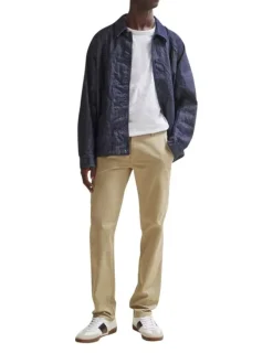 Pantalon Chino en coton beige uni avec une coupe slim et poches latérales