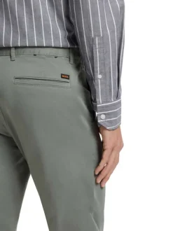 Pantalon chino en coton kaki à coupe slim pourvu d'une fermeture zippée