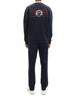 Pantalon Chino en coton marine uni avec une coupe slim et des poches latérales