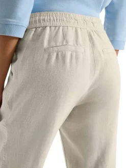 Pantalon chino en lin beige uni avec une coupe droite et une taille élastiquée