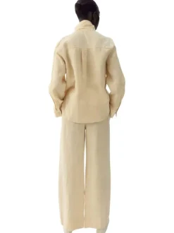 Pantalon chino en lin beige uni pourvu d'une coupe large et d'une taille haute