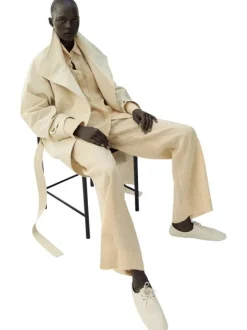 Pantalon chino en lin beige uni pourvu d'une coupe large et d'une taille haute