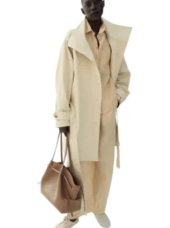 Pantalon chino en lin beige uni pourvu d'une coupe large et d'une taille haute