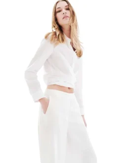 Pantalon chino en lin blanc uni avec une coupe flare et une taille élastiquée