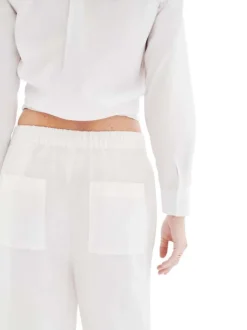 Pantalon chino en lin blanc uni avec une coupe flare et une taille élastiquée