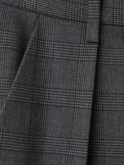 Pantalon Chino gris uni coupe ample orné d'un motif écossais