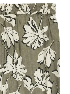Pantalon chino kaki à motifs pourvu d'une coupe large et d'une taille élastiquée