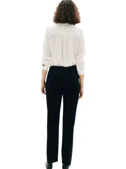 Pantalon Chino noir en maille côtelée pourvu d'une coupe bootcut