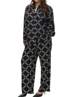 Pantalon chino noir à motifs géométriques imprimés avec une coupe ample