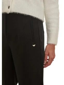 Pantalon Chino noir uni avec une coupe slim et un bijou décoratif