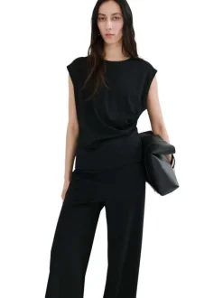 Pantalon chino noir uni pourvu d'une coupe bootcut et d'une taille haute