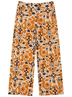 Pantalon chino orange en coton avec des motifs géométriques et une coupe flare