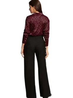 Pantalon chino à plis noir pourvu d'une coupe bootcut et d'une taille haute
