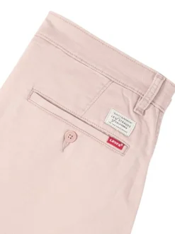 Pantalon chino rose à coupe slim pourvu du patch de la marque