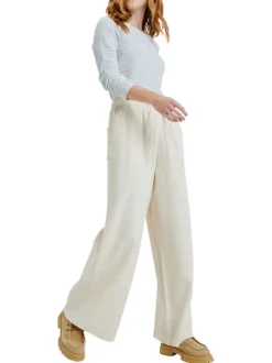 Pantalon écru à coupe ample pourvu de poches plaquées sur les côtés