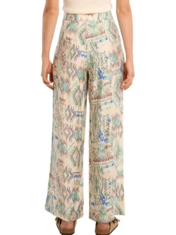 Pantalon écru pourvu de motifs aztec mulitcolores imprimés et d'une coupe large