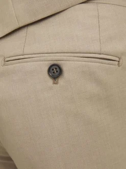 Pantalon de costume en laine mélangée beige avec une coupe slim fit