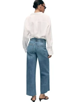 Pantalon denim en coton bleu indigo légèrement délavé à coupe jupe-culotte