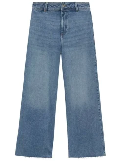 Pantalon denim en coton bleu indigo légèrement délavé à coupe jupe-culotte