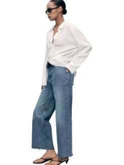 Pantalon denim en coton bleu indigo légèrement délavé à coupe jupe-culotte