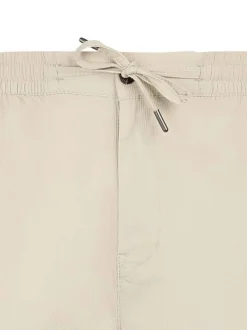 Pantalon en coton beige à coupe droite pourvu d'une taille élastiquée