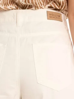 Pantalon en coton blanc uni pourvu d'une coupe baggy et d'une taille haute
