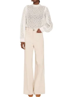 Pantalon en coton écru en velours côtelé avec une coupe bootcut