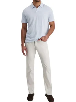 Pantalon en coton écru uni avec une coupe ajustée et des poches à l'italienne