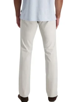 Pantalon en coton écru uni avec une coupe ajustée et des poches à l'italienne