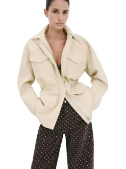 Pantalon en coton marron à pois pourvu de passants pour la ceinture
