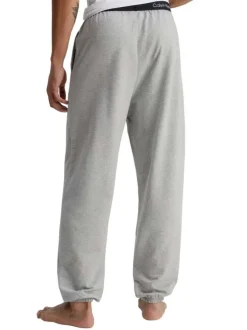 Pantalon Jogging en coton gris uni avec une coupe slim et poches latérales