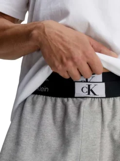 Pantalon Jogging en coton gris uni avec une coupe slim et poches latérales