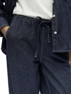 Pantalon jogging en coton indigo uni pourvu d'une coupe bootcut