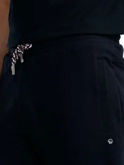 Pantalon jogging en coton mélangé marine uni pourvu d'une coupe droite