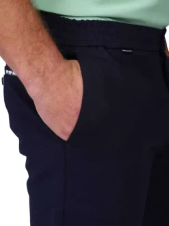 Pantalon jogging marine uni avec une coupe droite à zip et à bouton