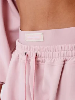 Pantalon Jogging rose uni avec une coupe droite et un logo imprimé