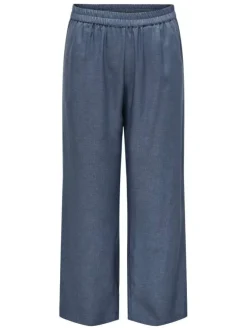 Pantalon large bleu indigo uni à coupe fluide avec une taille haute élastiquée