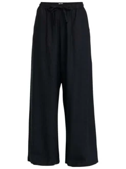 Pantalon noir à coupe ample pourvu de poches plaquées sur les côtés