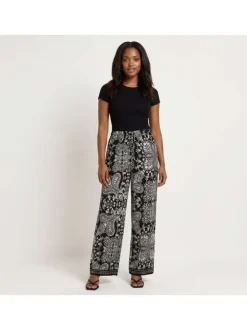 Pantalon noir à motifs pourvu d'une coupe droite et d'une taille élastiquée