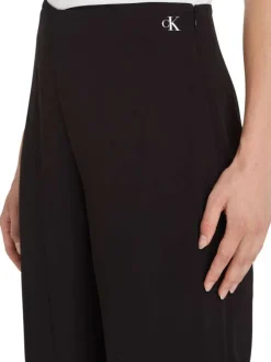 Pantalon noir uni avec une coupe large une taille haute et logo floqué