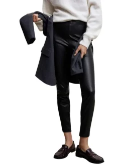 Pantalon noir uni avec une coupe skinny et un zip sur le côté